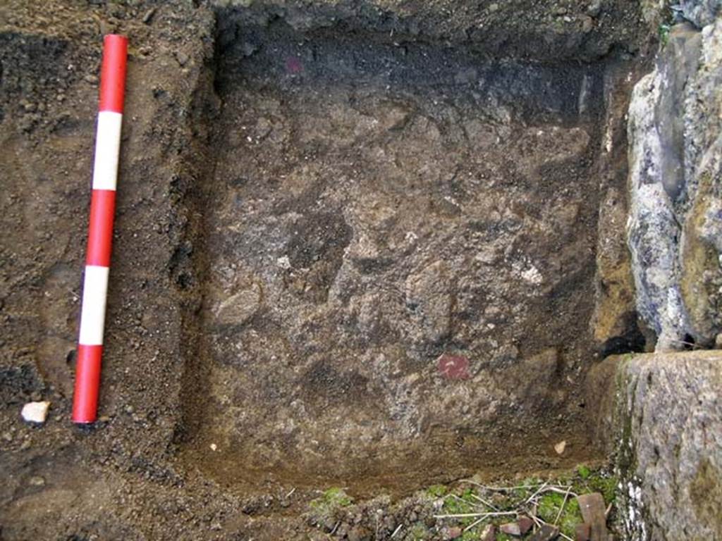 VI.25, herculaneum. May 2004. Detail of an investigation beneath the floor of the shop-room.
Looking south on the west side. Photo courtesy of Nicolas Monteix.